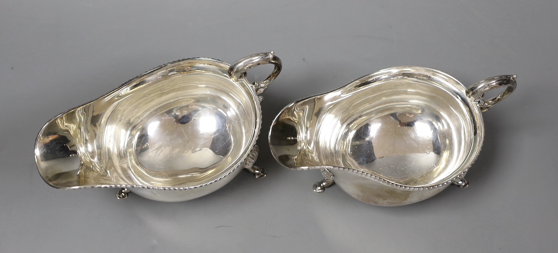 A pair of 1960's silver sauceboats by Garrard & Co, London, 1964, 11.7oz.